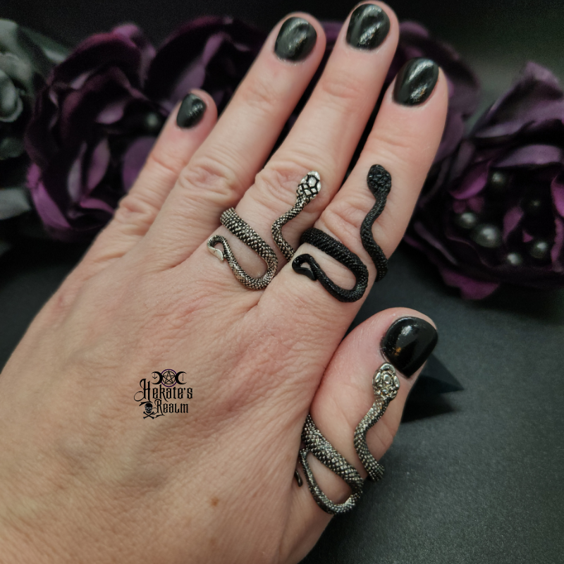 Snake Ring in three different colors being worn on a hand.