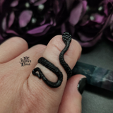 Black Snake Ring being worn on a finger.