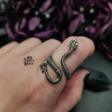 Gunmetal Snake Ring being worn on a finger.
