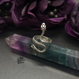Silver Snake Ring being displayed on a fluorite pointed crystal.
